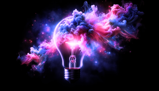 Incandescent light bulb with colorful smoke on black background